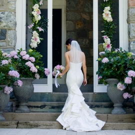 Glamorous bride in doorway by Traverse City Wedding Photographer Thomas Kachadurian